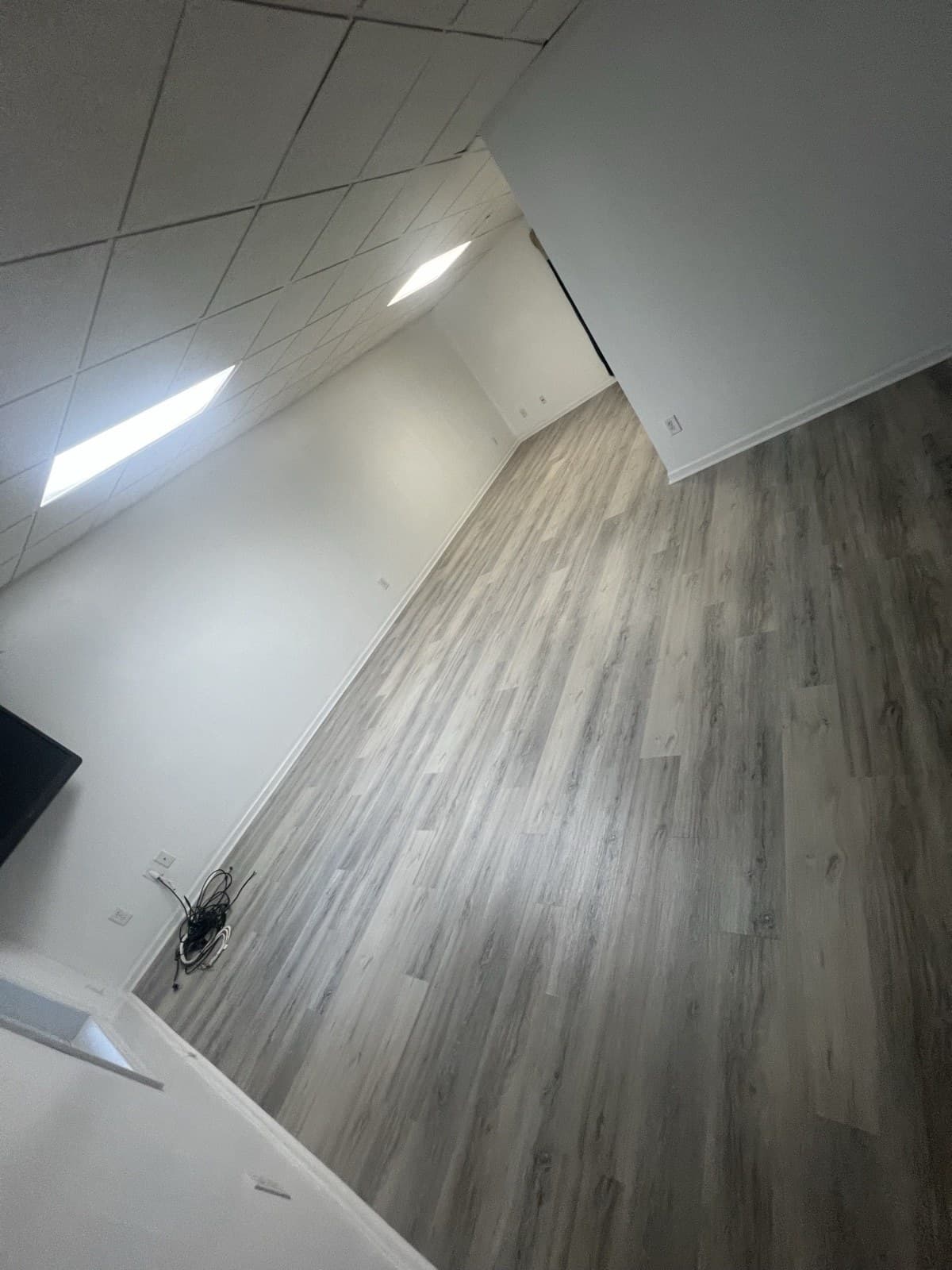 Gray LVP flooring installed in a commercial office space